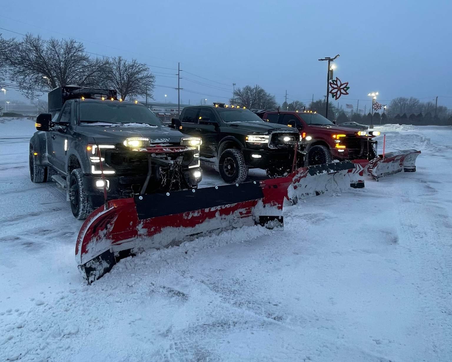 Plow truck at night in the snow